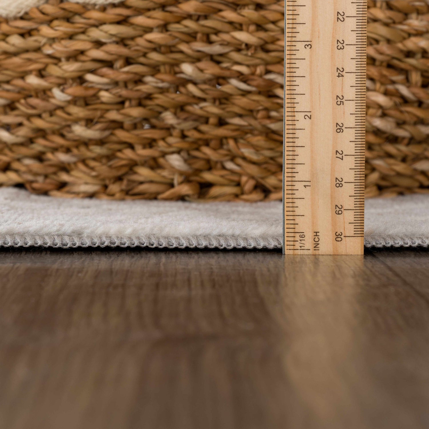 Close-up of Pointblank Tan Leopard Print Rug pile height, showing ivory color and machine woven construction. Pile