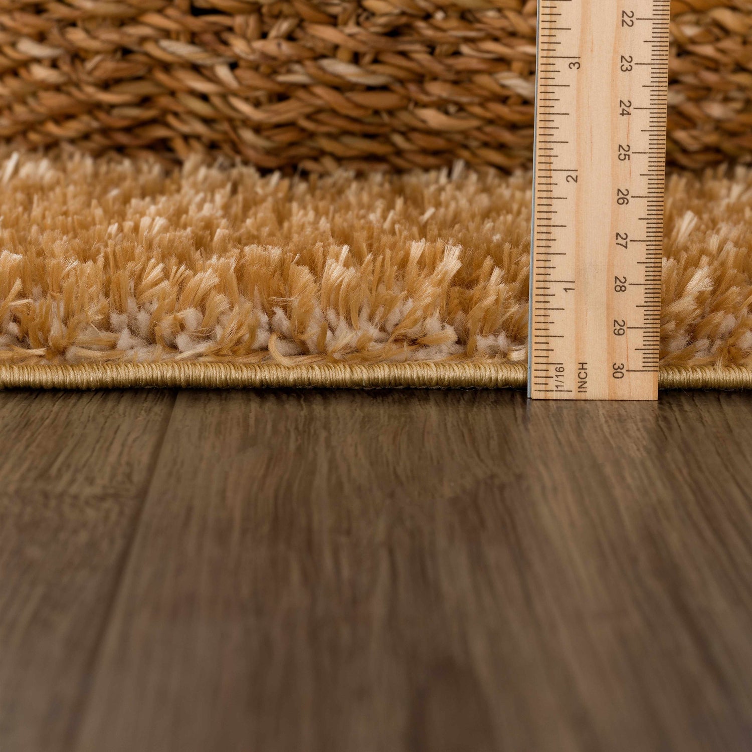 Close-up of Heavenly Solid Mustard Plush Rug showing its thick shag pile and construction, with a ruler for scale. Pile