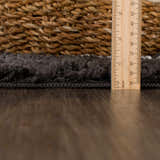 Close-up of the charcoal Ennis Area Rug showing its shag texture and thickness with a ruler for scale. Pile