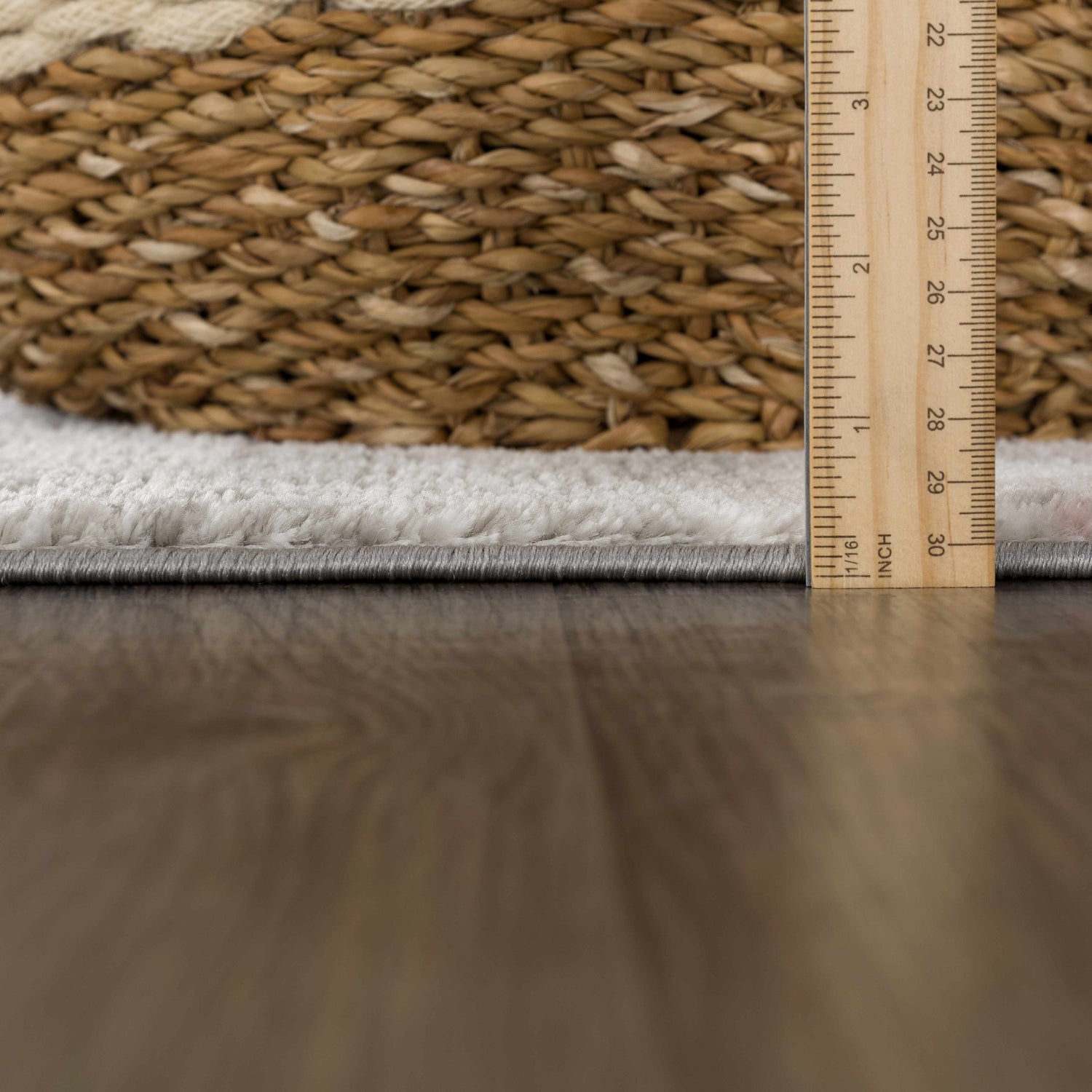 Close-up of the Lively Marble Pink Area Rug showing its plush texture and pile height with a ruler. Pile