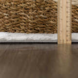 Close-up of the Live Marble Gray Area Rug showing its texture, gray edge, and pile height with a ruler. Pile