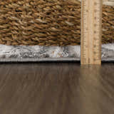 Close-up of the Live Marble Dark Gray Area Rug showing rug thickness with ruler and woven texture. Pile