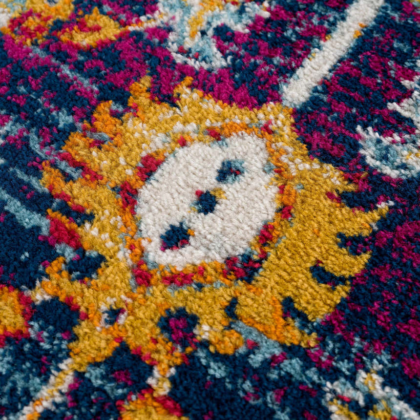 Close-up of the Istanbul Vintage Navy Area Rug showing its ivory, navy, yellow, and magenta floral pattern and texture. Texture