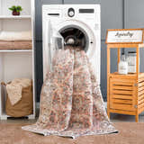 Laundry room scene with a Bian Washable Area Rug in the washing machine. Aqua, beige, and pink tones. Farmhouse style. Washing-Machine