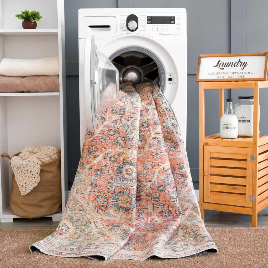 Laundry room scene with Konstantina Washable Area Rug being washed. Farmhouse style with peach, beige, and blue tones. Washing-Machine