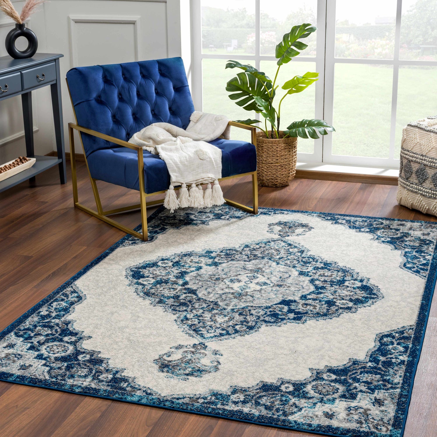 Living room scene with a blue chair and the Istanbul Blue Area Rug featuring a Persian-inspired design. Roomscene-Rectangle