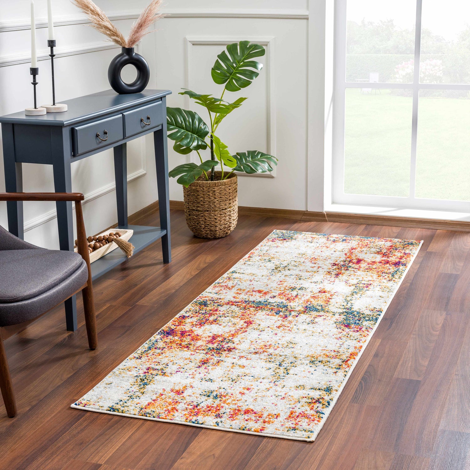 Entryway with Istanbul Abstract Area Rug runner, blue console table, gray chair, and wood floors. Roomscene-Runner