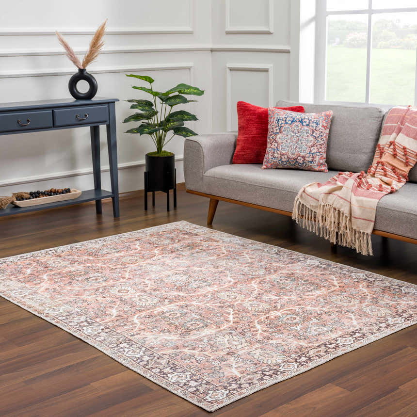 Living room scene with a Bian Washable Area Rug in peach and beige, styled with a gray sofa and blue console table. Roomscene-Rectangle