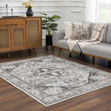 Living room scene with a gray sofa and the Liverpool Dark Gray Area Rug. Roomscene-Rectangle