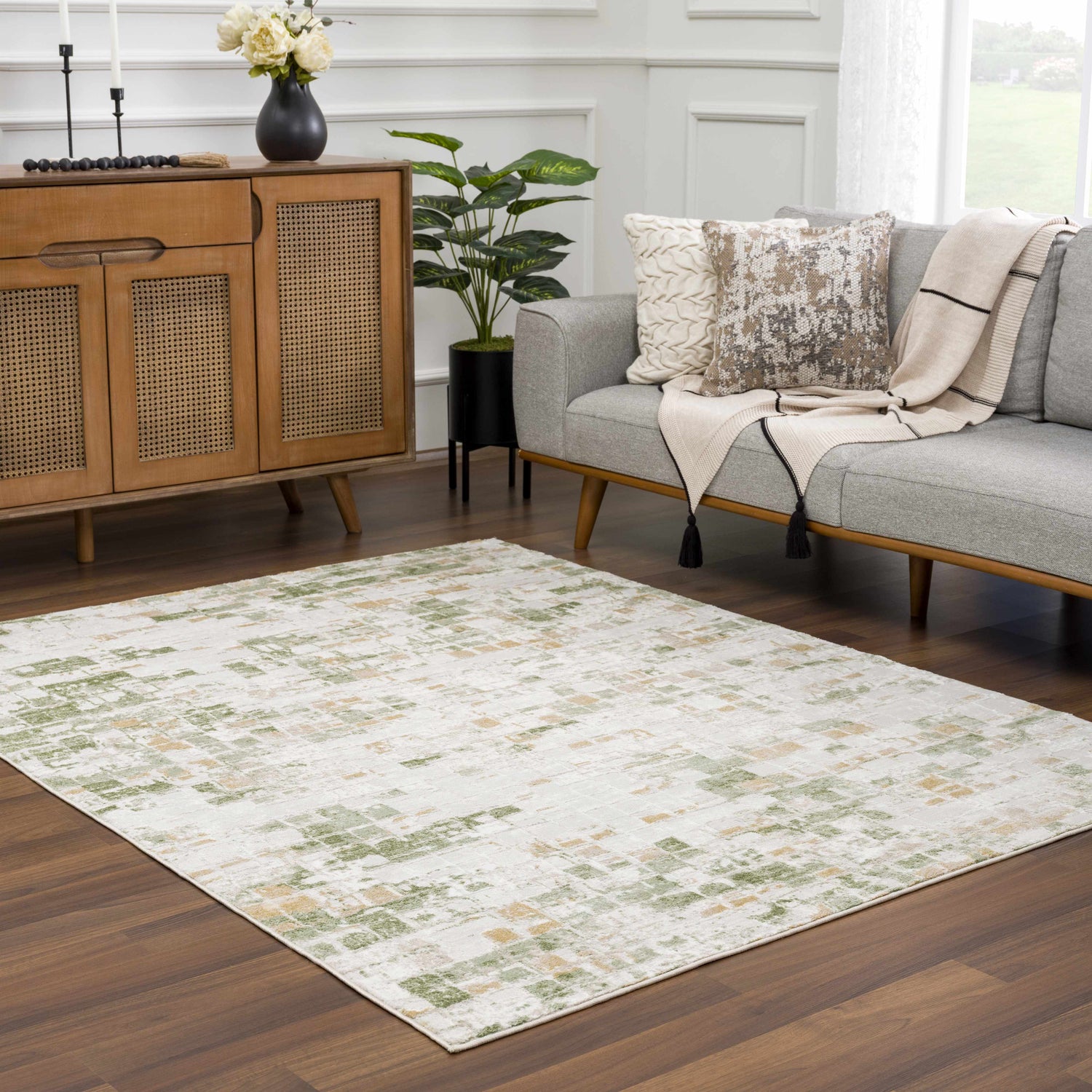 Living room with a gray sofa and the Liveri Green Mosaic Rug, adding a fresh, modern touch. Roomscene-Rectangle