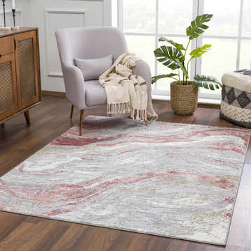 Living room scene with Lively Marble Pink Area Rug, gray chair, wood cabinet, and indoor plant. Roomscene-Rectangle