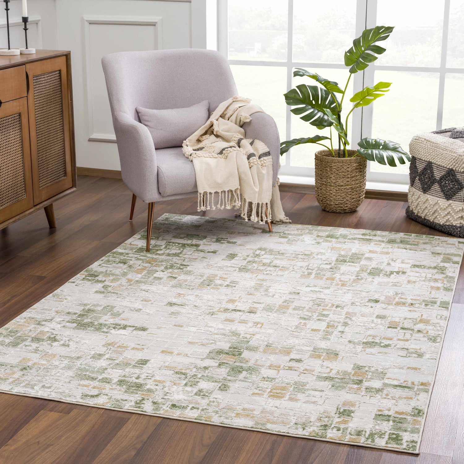 Living room scene with gray chair, wood cabinet, and Liveri Green Mosaic Rug. Roomscene-Rectangle