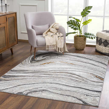 Living room scene with gray armchair and Live Marble Dark Gray Area Rug on dark wood floor. Roomscene-Rectangle