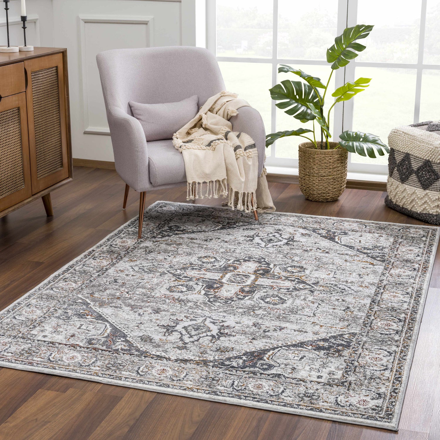 Living room scene with a gray chair and Liverpool Dark Gray Area Rug, creating a cozy, farmhouse-style space. Roomscene-Rectangle