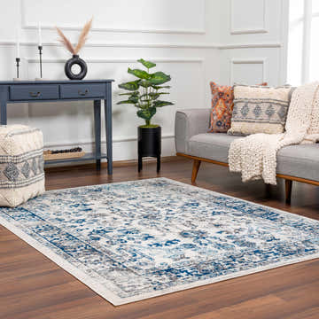 Living room scene with Istanbul Vintage Blue Area Rug, gray sofa, blue console table, and wood floors. Roomscene-Rectangle