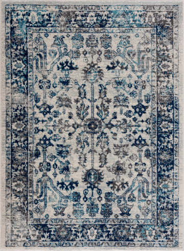 Close-up of the Istanbul Vintage Blue Area Rug, showcasing its ivory base and navy, gray, and blue traditional, oriental pattern. Design-Rectangle
