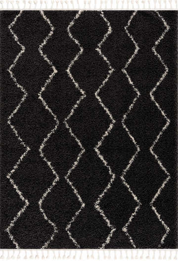 Close-up of the Ennis Area Rug. Charcoal shag rug with a light beige diamond pattern and tassels. Berber style. Design-Rectangle-23
