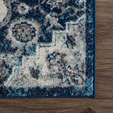 Close-up of the Istanbul Blue Area Rug showing its ivory, navy, and gray Persian-style design and soft texture. Swatch