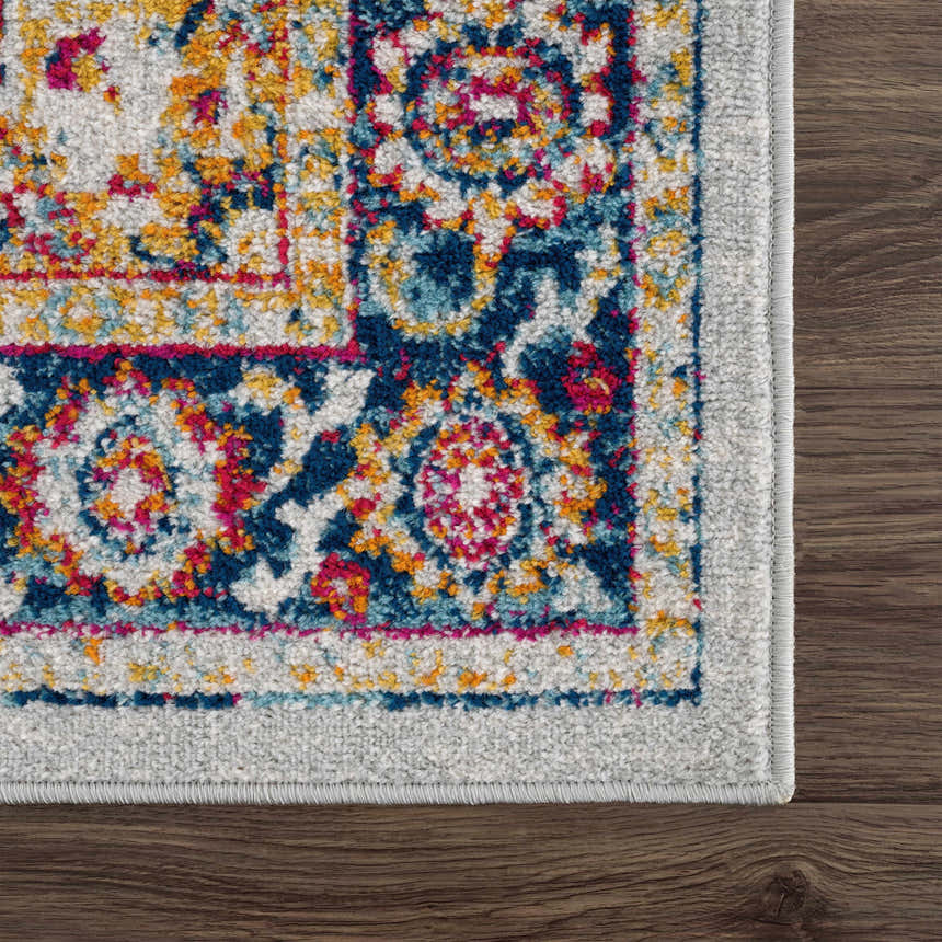 Close-up of Istanbul Medallion Orange Area Rug showing the ivory, navy, turquoise, and orange bohemian pattern. Swatch