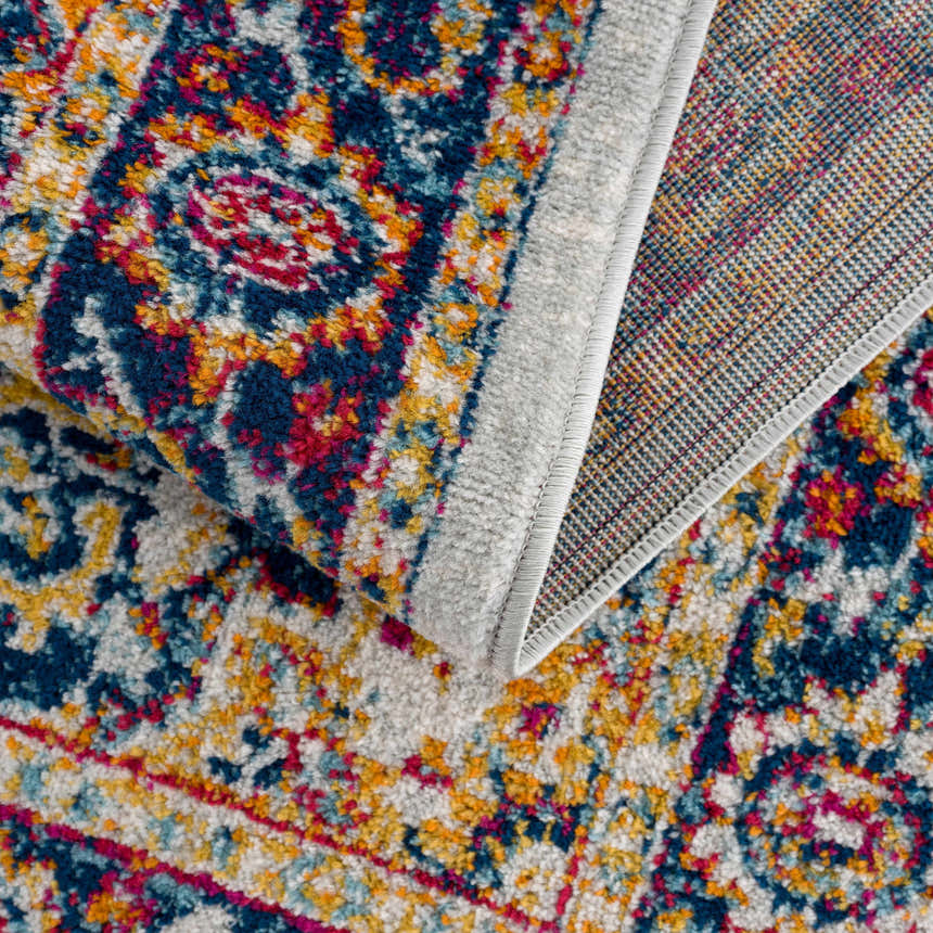 Close-up of the Istanbul Medallion Orange Area Rug showing its ivory, navy, turquoise, and orange bohemian design. Fold
