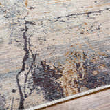Close-up of the beige, gray, and brown Alexi Luxe Rug with Fringes showing its contemporary pattern and soft texture. Texture