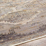 Close up of Clegg Luxe Rug with Fringes. Beige, gray, and tan traditional pattern with fringe detail. Texture