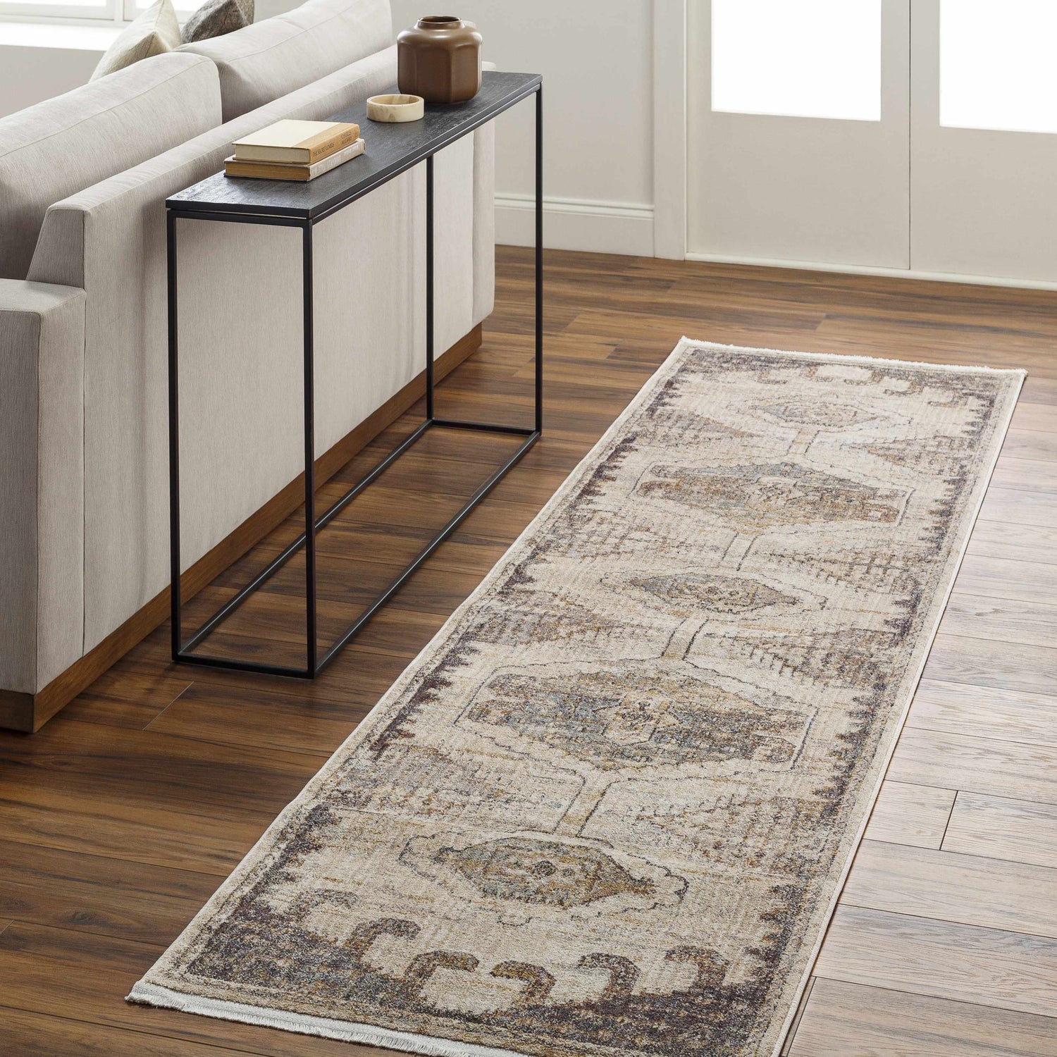 Living room scene with beige sofa and Clegg Luxe Rug in beige, gray, and brown. Roomscene-Runner