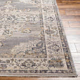 Close-up of the Cream Brown Zola Area Rug showing its beige, gray, and nutmeg traditional floral pattern and soft texture. Front