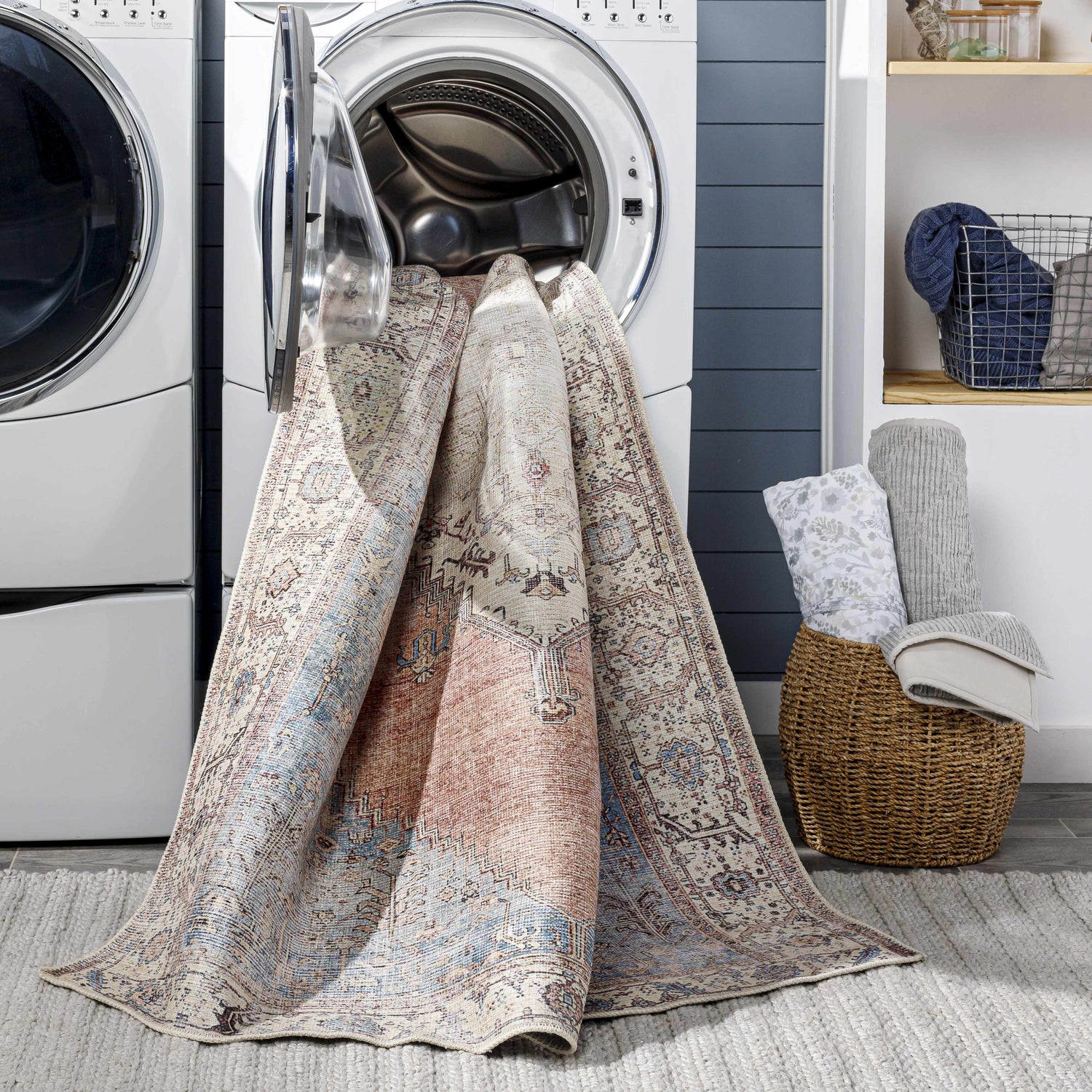 Sacriston Washable Area Rug in laundry room coming out of washing machine. Bohemian style rug with aqua, rose, and tan colors. Washing-Machine