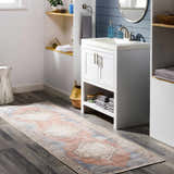 Bathroom scene with a Sacriston Washable Area Rug runner in aqua, rose, and blue, adding a bohemian touch to the gray wood floor. Roomscene-Runner