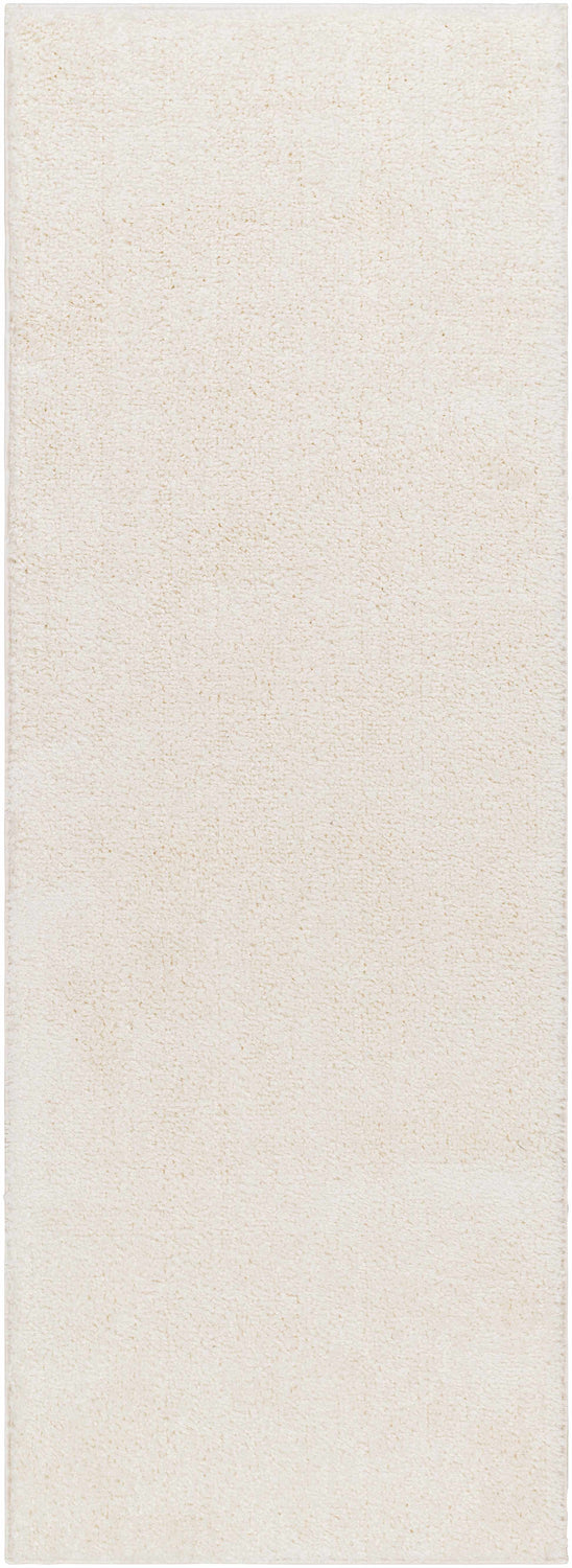 Close-up of the Judy White Washable Area Rug, showing its plush shag texture and off-white color. Design-Runner-2773