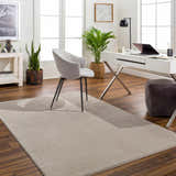 Bright home office with white desk and tan Aldis Plush Textured Washable Rug adding warmth to the wood floor. Roomscene-Rectangle
