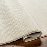 Close-up of a Lambswool Kini Plush Textured Washable Rug showing the plush texture and ribbed design. Fold