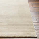Close-up of the Kini Plush Textured Washable Rug in Lambswool showing its soft texture and subtle horizontal lines. Front