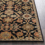 Close-up of the Salix Hand Tufted Black Wool Rug, featuring a traditional floral pattern in black, tan, rust, and olive tones. Front