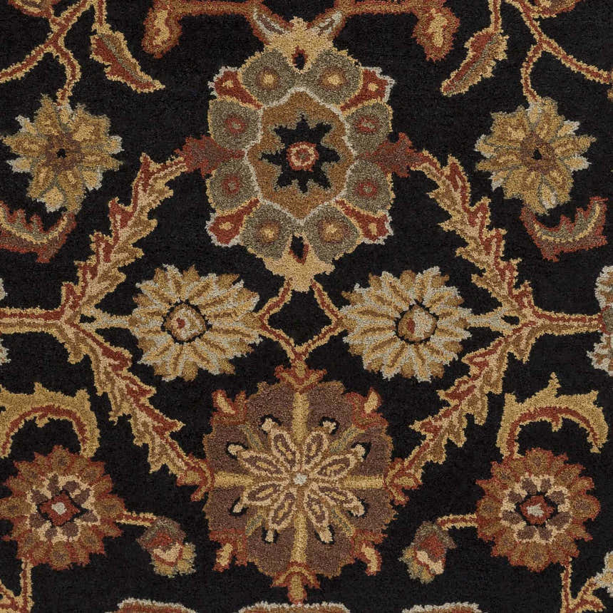 Close-up of the Salix Hand Tufted Black Wool Rug, showcasing its floral pattern in brick red, camel, and mustard tones. Swatch