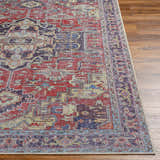 Close-up of the Reza Red Washable Rug showing its traditional, farmhouse-style pattern and rich garnet, brown, and bone colors. Front