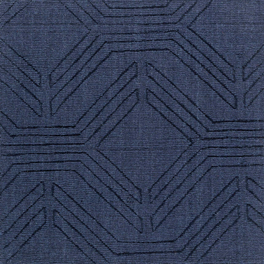 Close-up of the dark blue Sarona Area Rug, a hand-loomed wool rug with a contemporary geometric pattern. Swatch