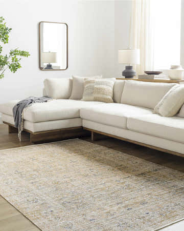 Living room scene with a cream sectional and the Margaret Damask Mustard Washable Area Rug. Roomscene-Rectangle