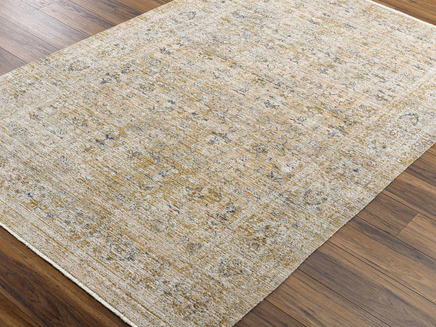 Close-up of the Margaret Damask Mustard Washable Area Rug showing its traditional pattern and colors. Corner
