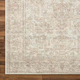 Close-up of the Margot Medallion Dusty Coral rug showing beige, bone, and dusty coral colors with a traditional medallion pattern. Swatch