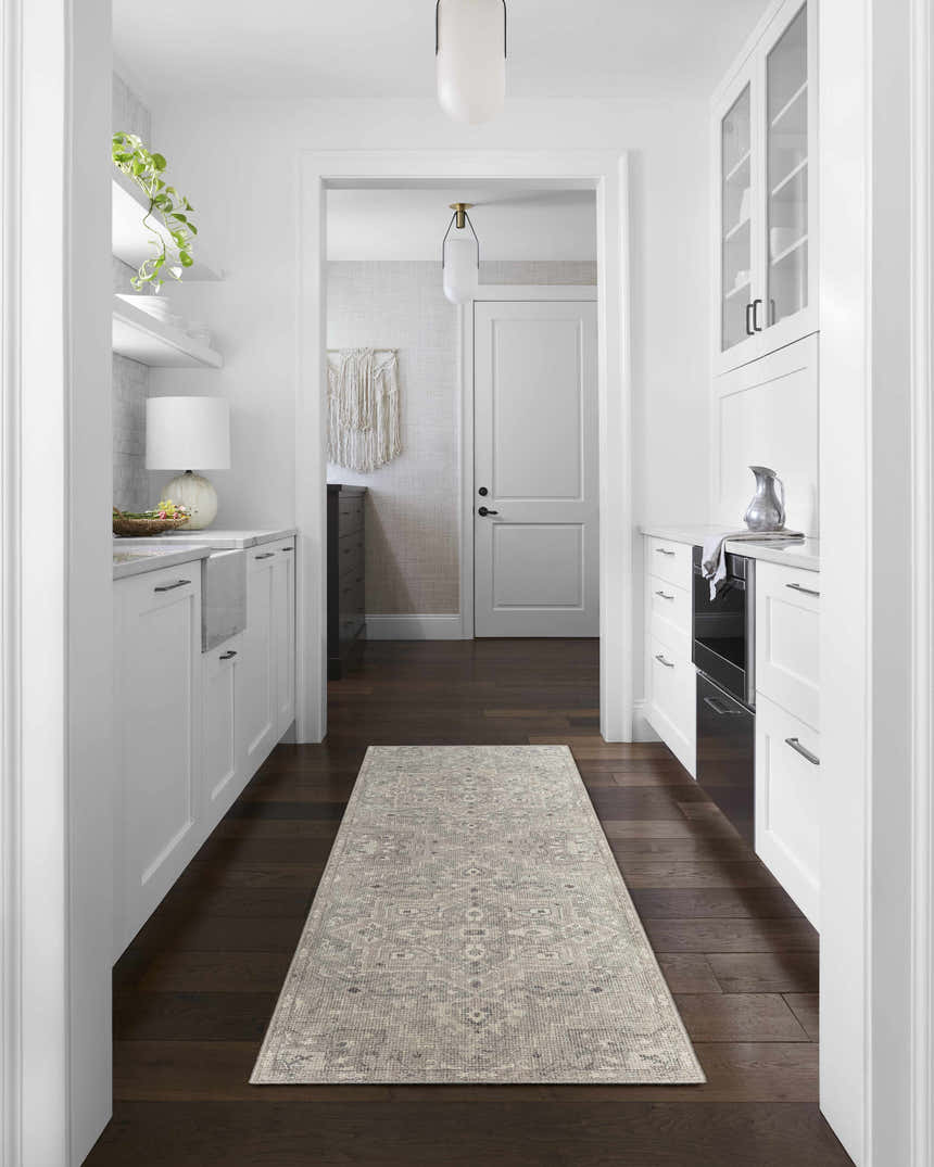 Bright, white kitchen with Margot Medallion Dusty Coral runner rug on dark wood floor. Livabliss x Becki Owens. Roomscene-Runner