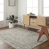 Living room scene with a Jeven Blue Area Rug, wood floors, and a light wood cabinet with rattan details. Roomscene-Rectangle