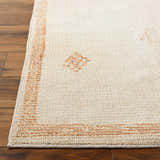 Close up of Solana Medallion Peach rug. Beige rug with peach medallion pattern and border on dark wood floor. Front