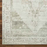 Close-up of the Luca Medallion Olive Area Rug showing its beige, bone, and olive traditional medallion pattern and woven texture. Corner