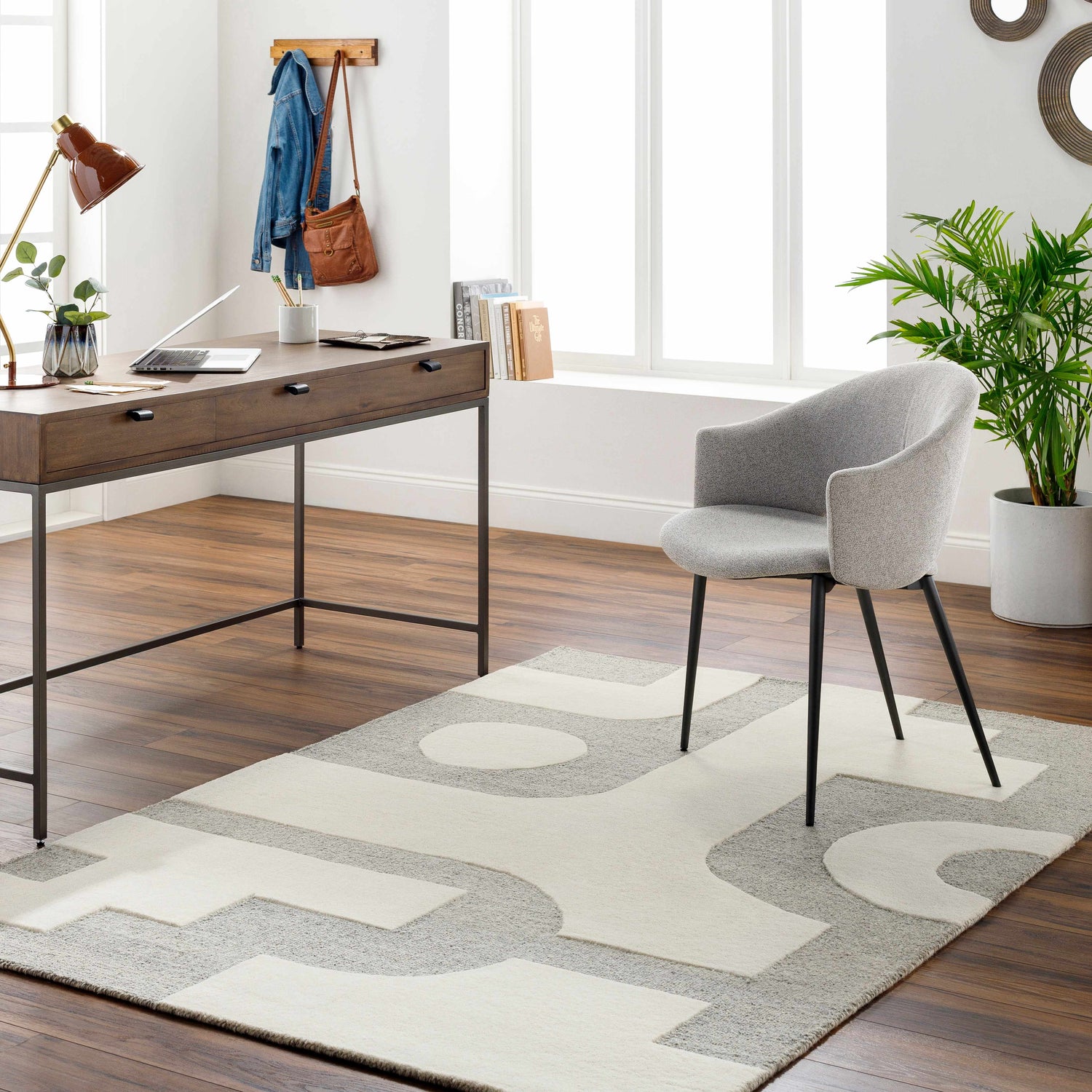 Home office with wood desk, gray chair, and Aiden Area Rug in beige and gray. Contemporary style. Roomscene-Rectangle