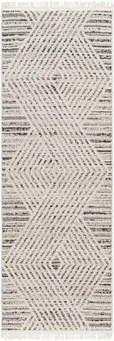 Close-up of the Brita Area Rug, showcasing its bone and dark brown geometric pattern and soft, textured weave. Design-Runner-2710