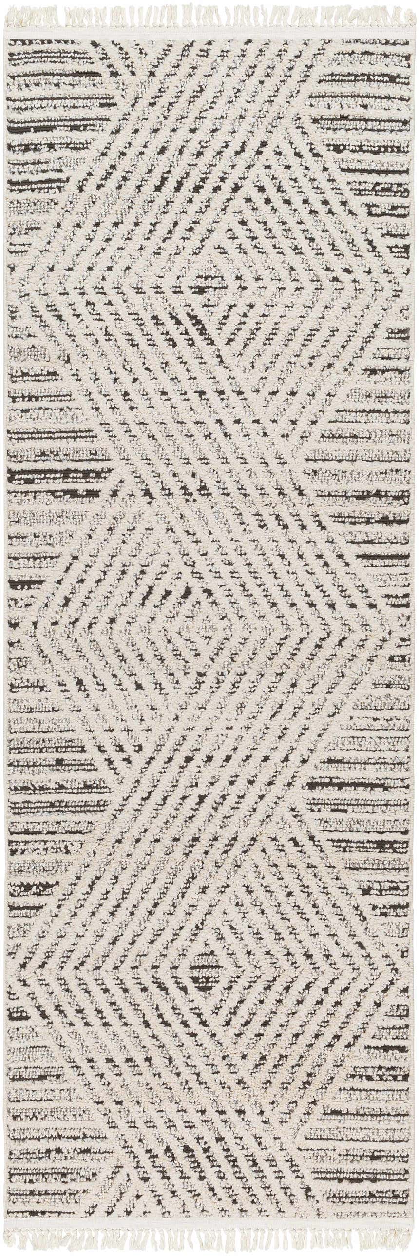 Close-up of the Brita Area Rug, showcasing its bone and dark brown geometric pattern and soft, textured weave. Design-Runner-2710