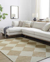 Living room scene with a beige sectional sofa and the Sondo Beige Area Rug with a diamond pattern. Roomscene-Rectangle