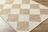 Close-up of the Sondo Beige Area Rug, a hand-woven cotton and jute rug with a contemporary checkerboard pattern. Corner